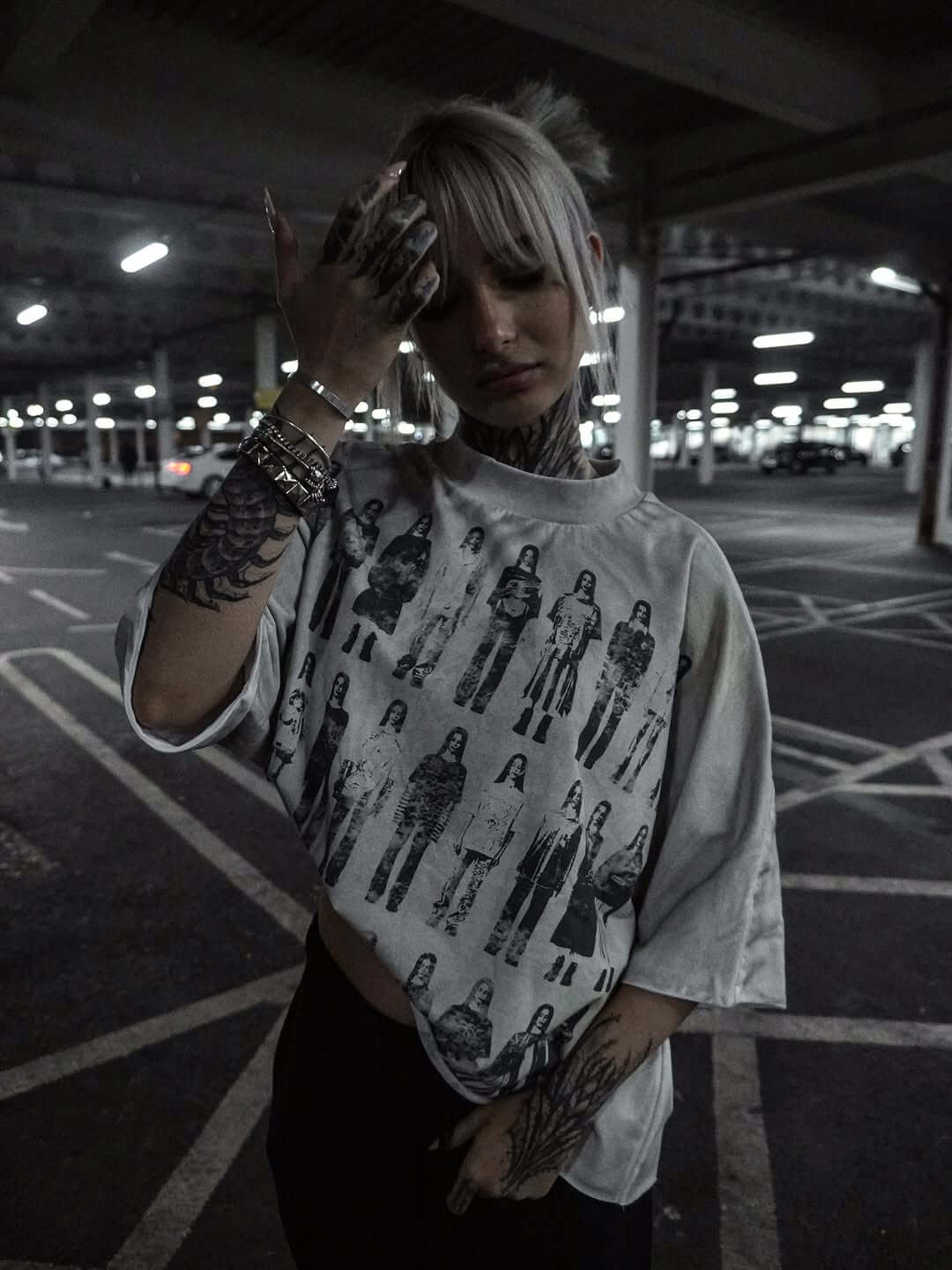 Model wearing VSO Runway Tee in a vintage wash, showcasing double-layered seamless design in urban setting.